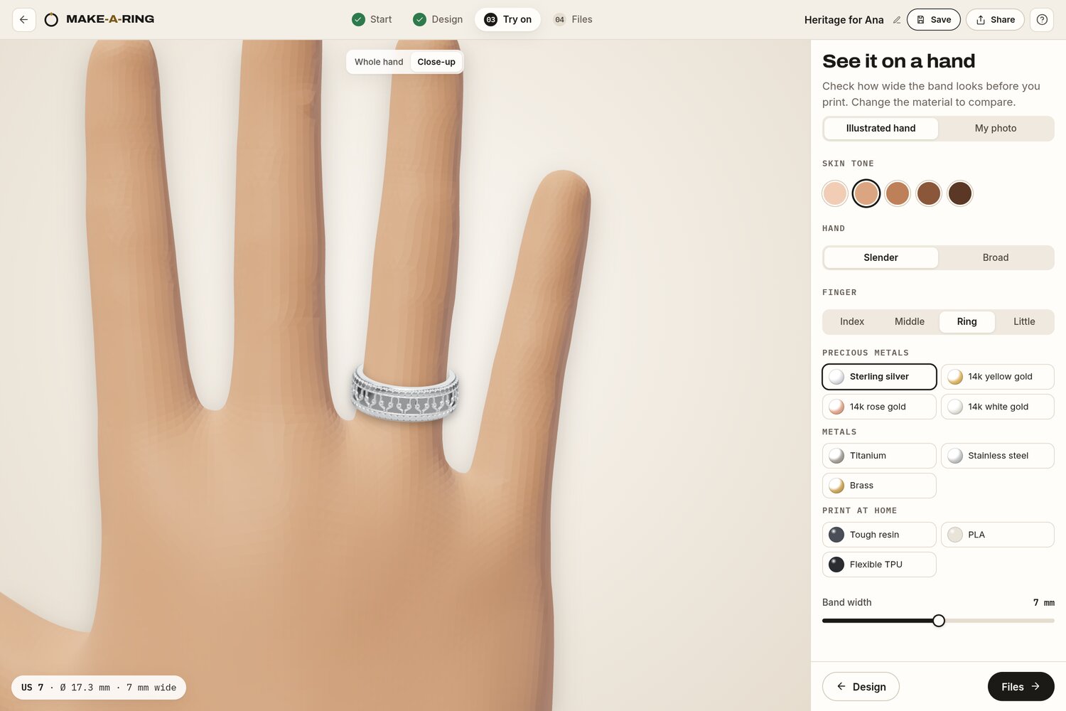 The try-on screen, with the silver ring on the ring finger of a 3D hand and controls for skin tone, hand build, finger and material.